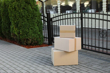 Fototapeta na wymiar Stack of parcels delivered near front gates