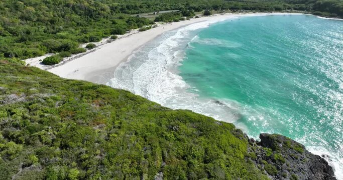 Tropical Island - Drone View of water, waves and an isolated bay...
