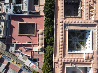 aerial photo view of the downtown of a hispanic city puebla, mexico, historical center with trees in the streets and colorful buildings