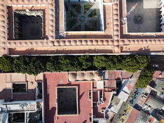 aerial photo view of the downtown of a hispanic city puebla, mexico, historical center with trees in the streets and colorful buildings