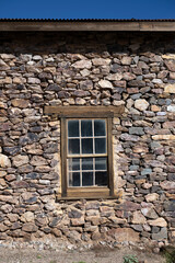 A window in an old rock wall