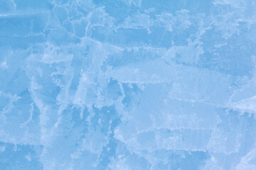 Texture of winter ice surface. Blue natural ice background