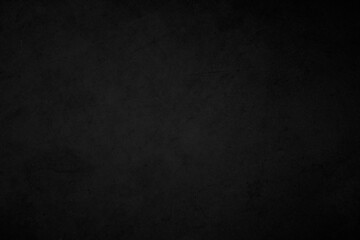 Art black concrete stone texture for background in black. Cement and sand grey dark detail covering.	