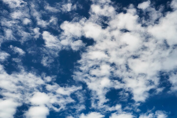 sunny weather background with blue sky and white clouds pattern all around