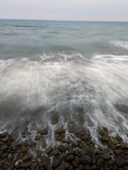 waves and rocks on the beach long exposure photo in america, mexico, hispanic beach