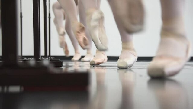 Ballet class pointé shoe feet close up.