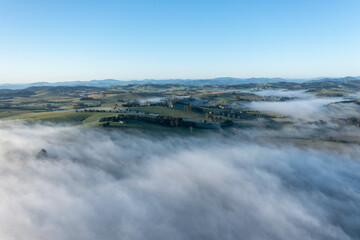 Morning fog over farmland