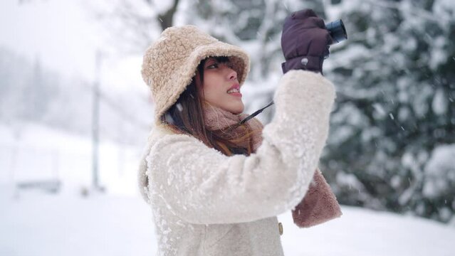 woman, digital camera, photography, snow, winter, village, vacation, travel, asia, asian, attractive, beautiful, clothing, cold, covered, footpath, forest, frozen, girl, happy, japan, japanese, journe