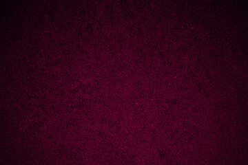 Black plum maroon rough texture background for design. Toned rough wall surface. Deep magenta color.