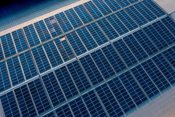 Obraz premium Solar photovoltaic rows array of roof mount system Installation. Solar power plant for producing alternative energy for sustainable development. renewable energy, roof plan