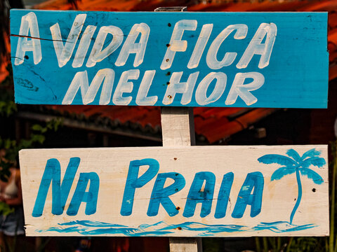Two wooden signs with the inscription: Life is better at the beach. blurred background,
wooden tablet, illustration