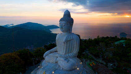 big buddha on high mountain in Phuket Thailand,Amazing light of sunset nature Landscape nature background