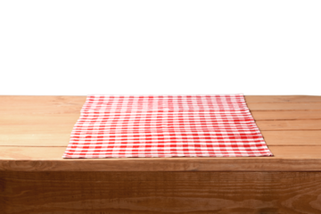 The empty wooden table covered with a color Picnic tablecloth.