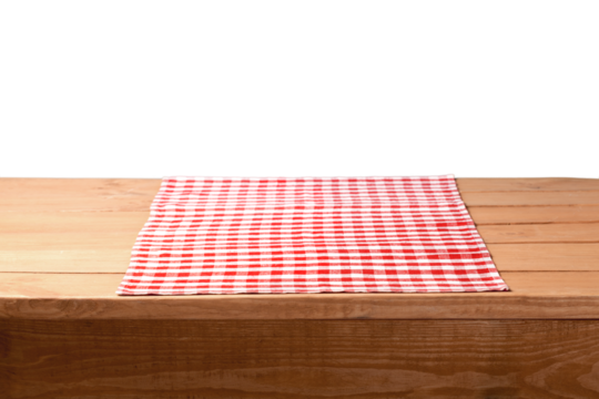 The empty wooden table covered with a color Picnic tablecloth.