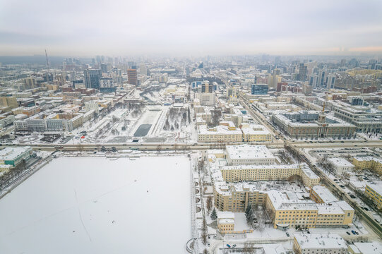 Embankment of the central pond and Plotinka in Yekaterinburg at winter sunset. The historic center of the city of Yekaterinburg, Russia, Aerial View