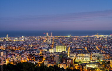 Fototapeta na wymiar The skyline of Barcelona in Spain at twilight