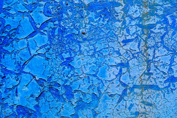 Rough textured wall surface with cracked paint. Backdrop for design, graphic resource