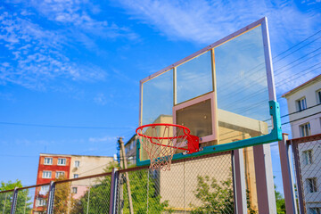 Basketball hoop on the playground. Background with selective focus and copy space