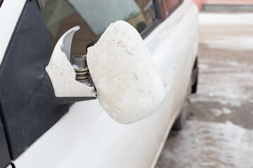 Broken rearview mirror on car.
