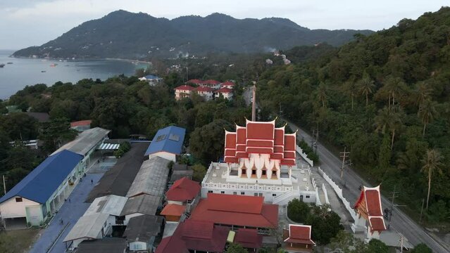 Cars passing by a temple in koh tao, souh thailand