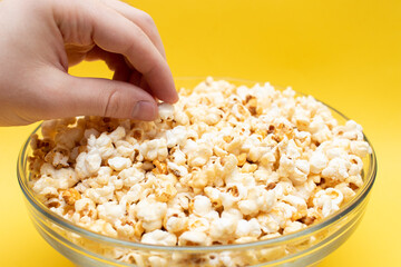 Hand picking a tasty popcorn