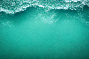 Fototapeta na wymiar Turquoise sea wave as it crashes against the coast, captured from a top-down view. The vibrant blue-green hues of empty space, making it a versatile layout concept for text and advertising Top view ai