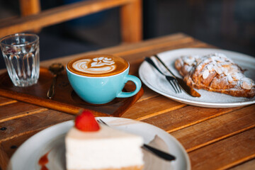 Coffee Breakfast with Cheesecakes and Water with flowers