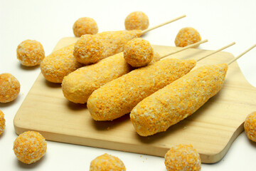 Corn dog and breaded mozzarella cheese Balls, traditional korean street food. Isolated