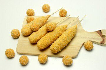 Corn dog and breaded mozzarella cheese Balls, traditional korean street food. Isolated
