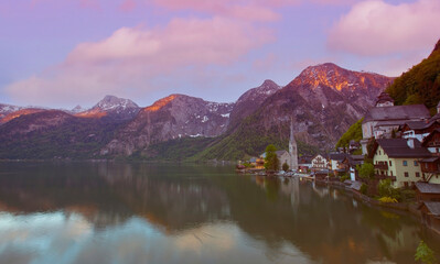 Landmark of tourist view in spring at  Hallstatt, Austria. Mountain village in the Austrian Alps at sunrise sky background