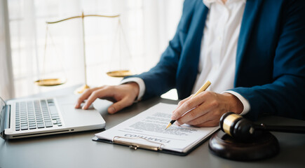 justice and law concept.Male judge in a courtroom on wooden table and Counselor or Male lawyer working in office. .