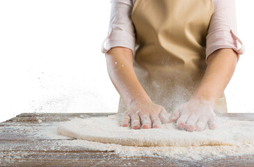 Obraz na płótnie Canvas Making dough by female hands. Woman cooking.