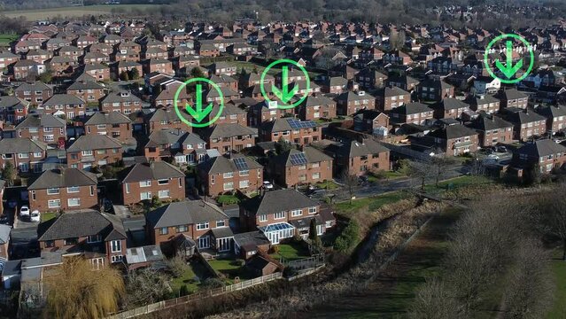 Multiple green arrow symbols flashing above neighbourhood house rooftops aerial view