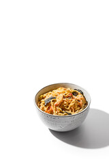 Asian fried noodles with chicken in creamy garlic sauce isolated on white background Chinese fried noodles in creamy sauce in ceramic bowl. Stir-fry udon with chicken in minimal style. Wok menu