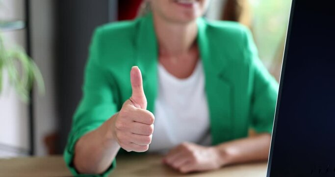 Business woman showing thumb up sign of approval and recommendation
