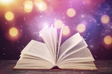 Open old Book with magic glowing light