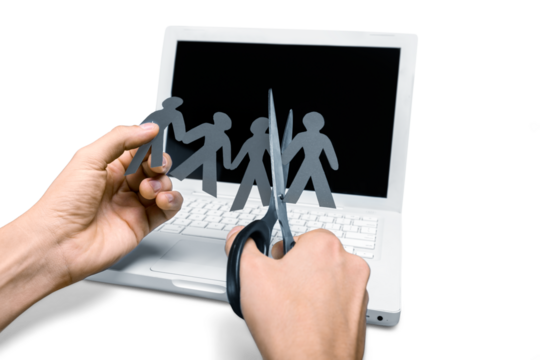 Closeup of Hands Cutting Paper People