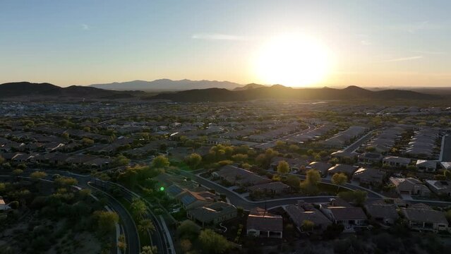 Panning aerial view of the Vistancia planned neighborhood in Peoria, Arizona at sunset.