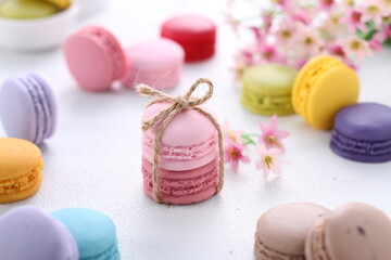 A macaron or French macaroon is a sweet meringue-based confection made with egg white, icing sugar,...