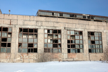 abandoned factory shop, windows are broken