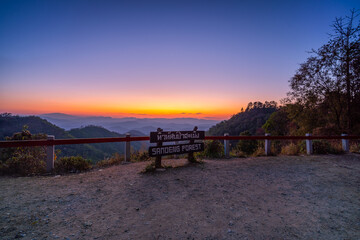 Fototapeta na wymiar Colorful sunset in the mountains landscape, Sunset in mountains at Samoeng View Point, Chiang Mai in Thailand. Mountain valley during sunset, sunrise. Natural summer landscape