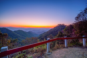 Colorful sunset in the mountains landscape, Sunset in mountains at Samoeng View Point, Chiang Mai in Thailand. Mountain valley during sunset, sunrise. Natural summer landscape