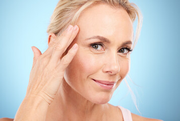 Facial beauty, face and woman touch skincare on mockup, blue background and wellness cosmetics....