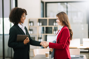 business people shaking hands during a meeting in office