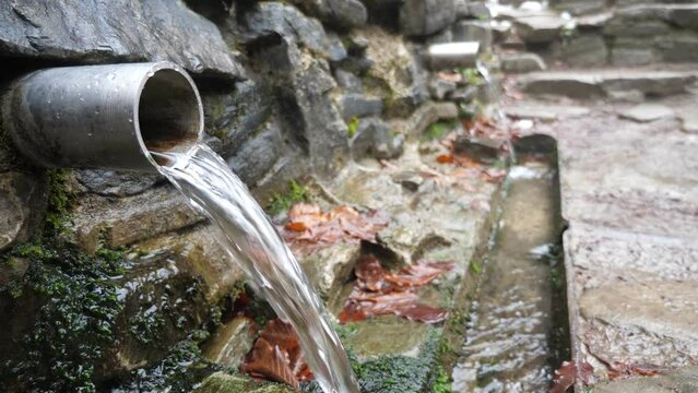 Source of mineral water high in the mountains, slow motion