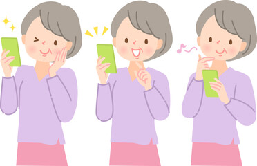 スマホを持って笑顔になるエプロン姿の中年女性セット