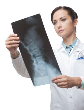 Female radiologist checking x-ray image