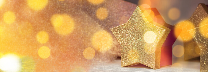 Background of abstract gold glitter lights a star. Defocused