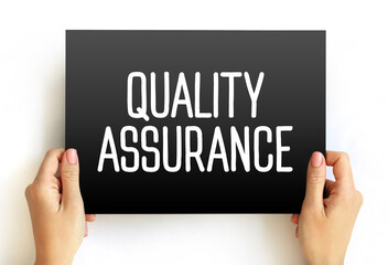 Quality Assurance - systematic process of determining whether a product or service meets specified requirements, text concept on card - obrazy, fototapety, plakaty