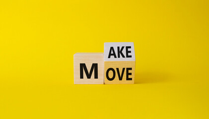 Make your Move symbol. Turned wooden cubes with words Make Move. Beautiful yellow background. Business and Make your Move concept. Copy space